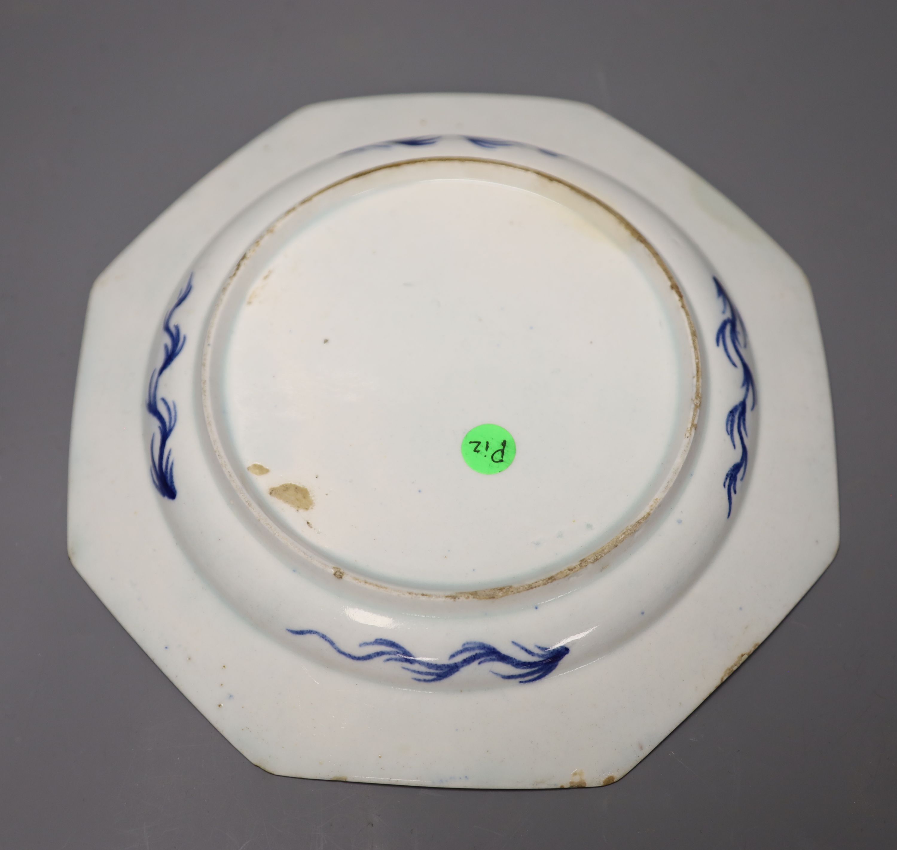 An 18th century Bow octagonal plate painted with landscapes or flowers in circular or fan-shaped panels on a powder blue ground, 19cm